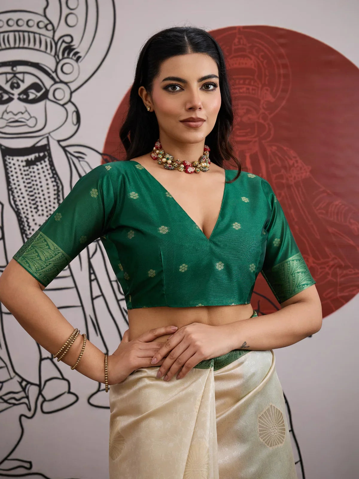 Tarani green silk blouse close-up with deep neckline and elegant weave