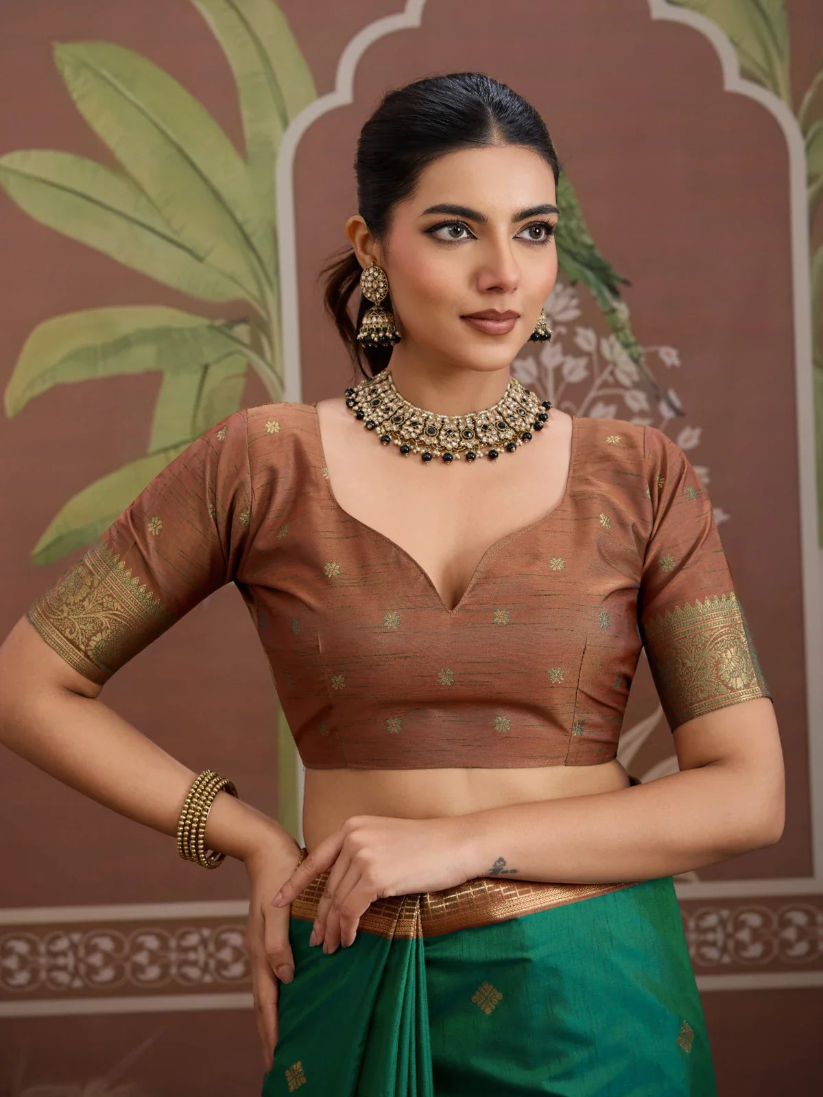 Tarani green silk saree blouse close-up showing neckline and sleeve zari work