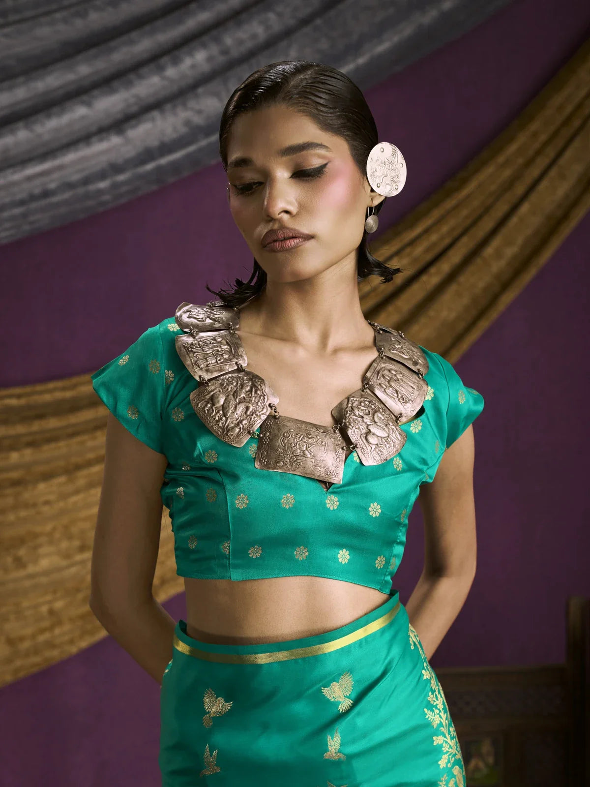 Tarani green silk saree upper body closeup showing blouse neckline and woven design