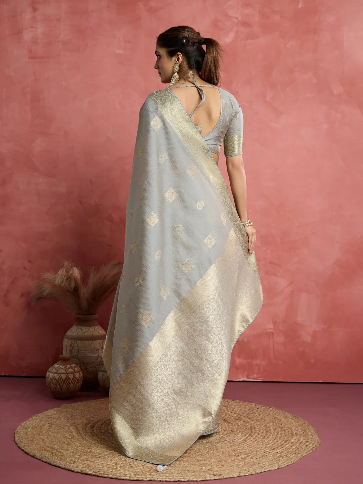Tarani back view of grey silk saree with blouse design and pallu