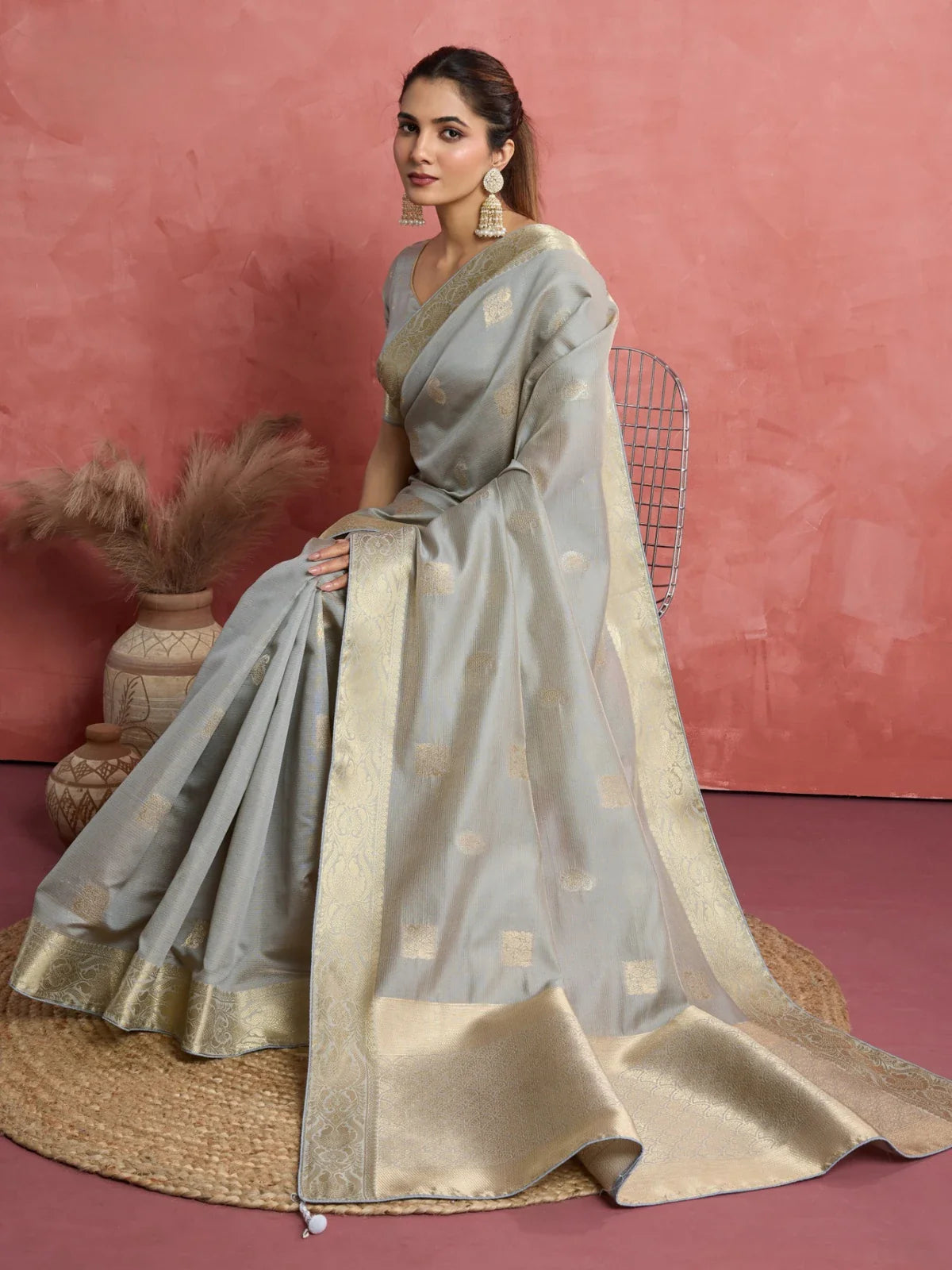 Tarani front seated look of grey silk saree with golden woven pallu
