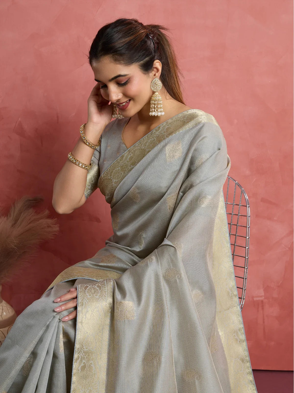 Tarani side view of grey silk saree with woven butta and elegant drape