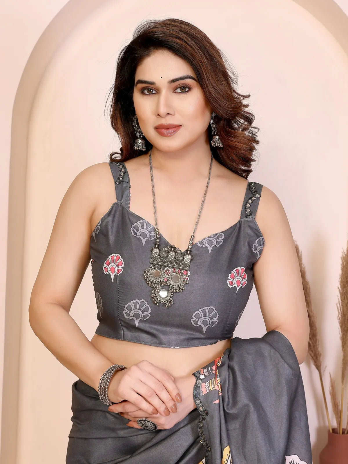 Tarani Manipuri silk saree closeup showing embroidered blouse and mirror work border