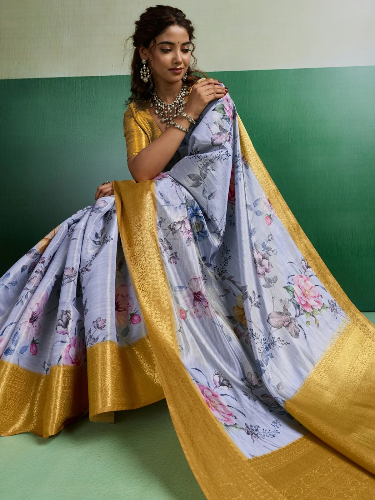 Tarani pallu view of floral tissue silk saree with rich border