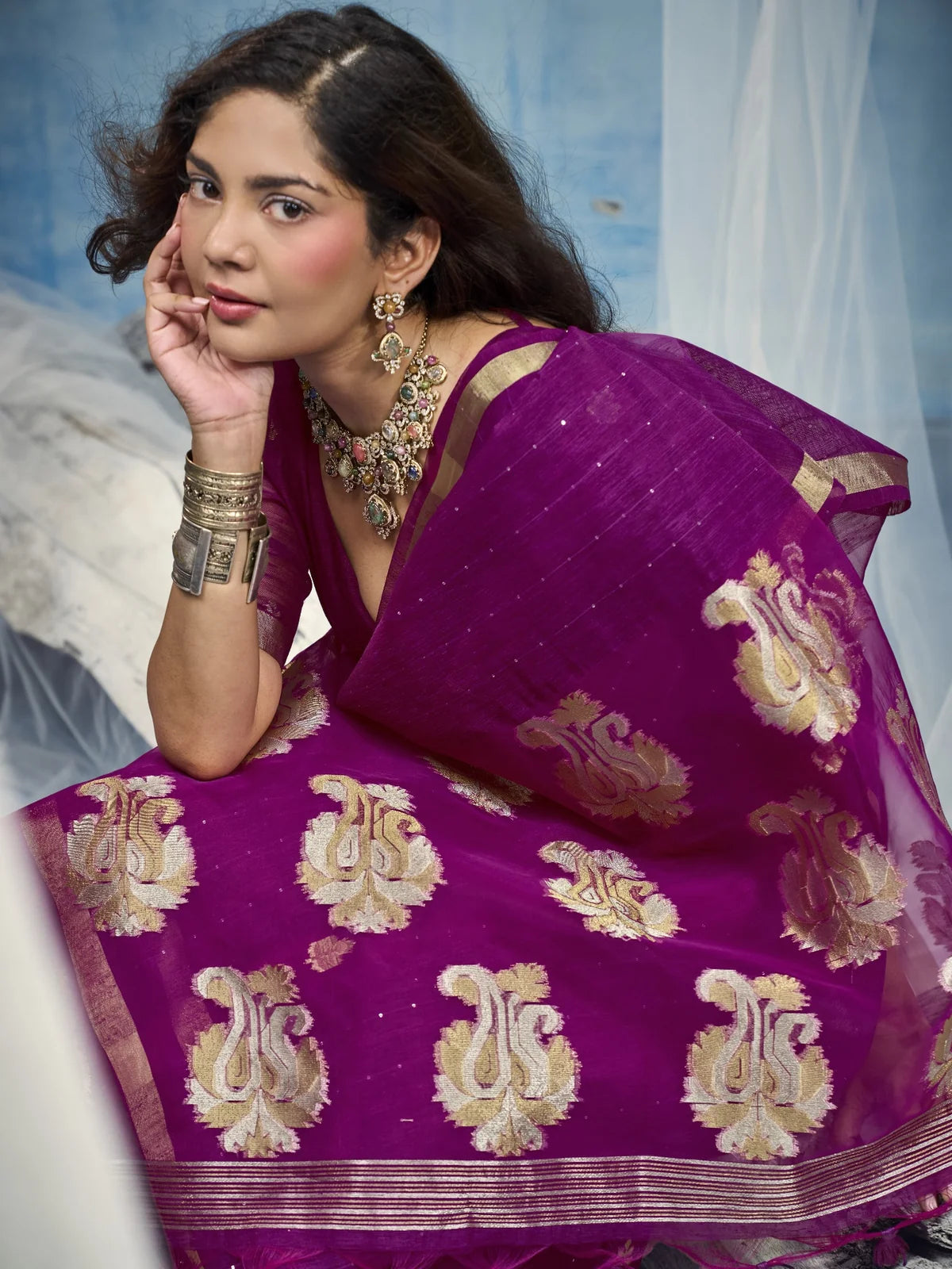 Tarani closeup of woven motifs and organza pallu on magenta handloom saree
