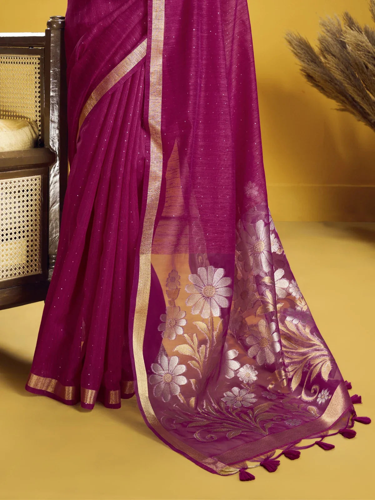 Tarani saree floral zari work pallu close-up with border tassels in magenta