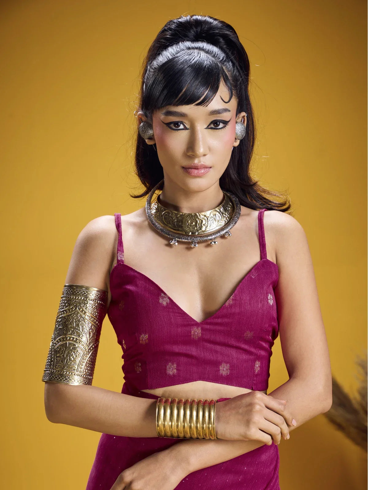 Tarani close-up of magenta silk blouse with zari detailing and traditional jewelry