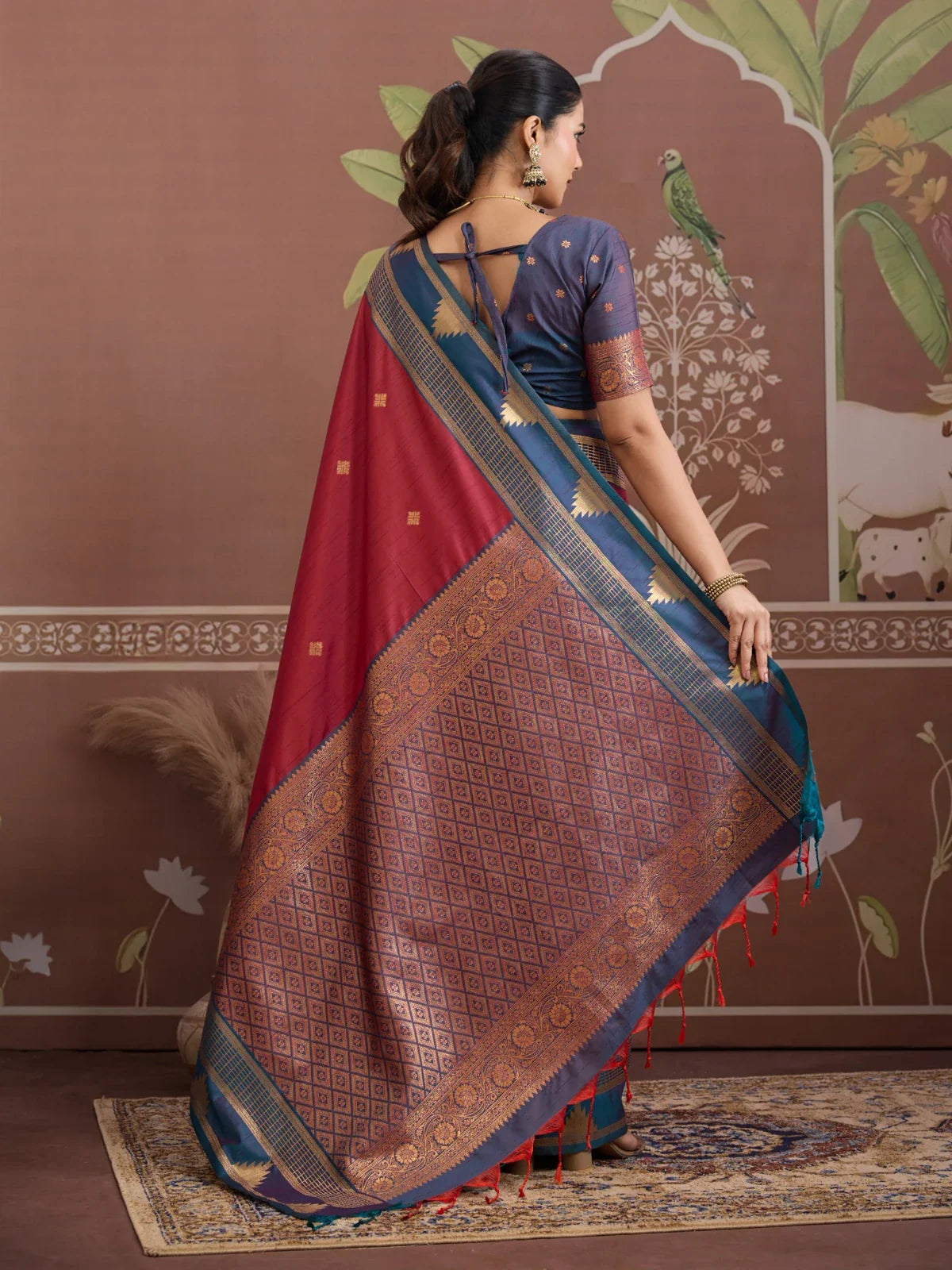 Tarani maroon saree back view with rich blue blouse and golden zari work
