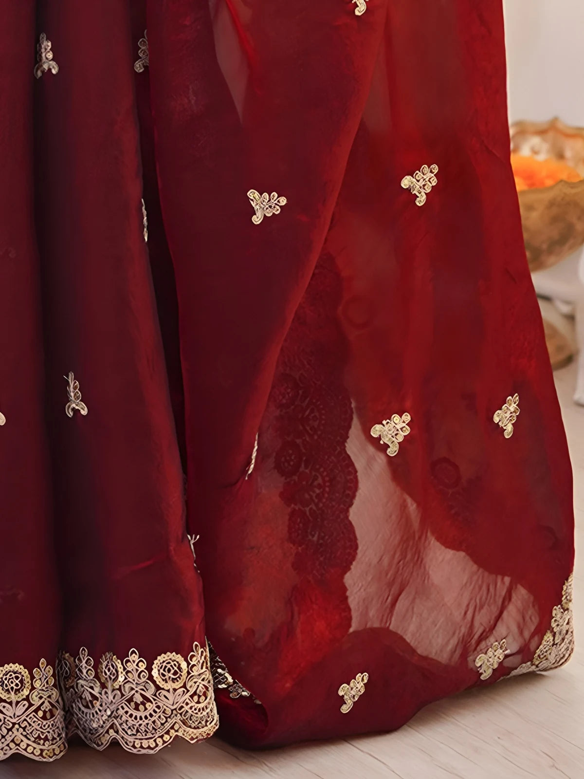 Tarani Mrunmayi maroon saree closeup of embroidery motifs and cutwork border