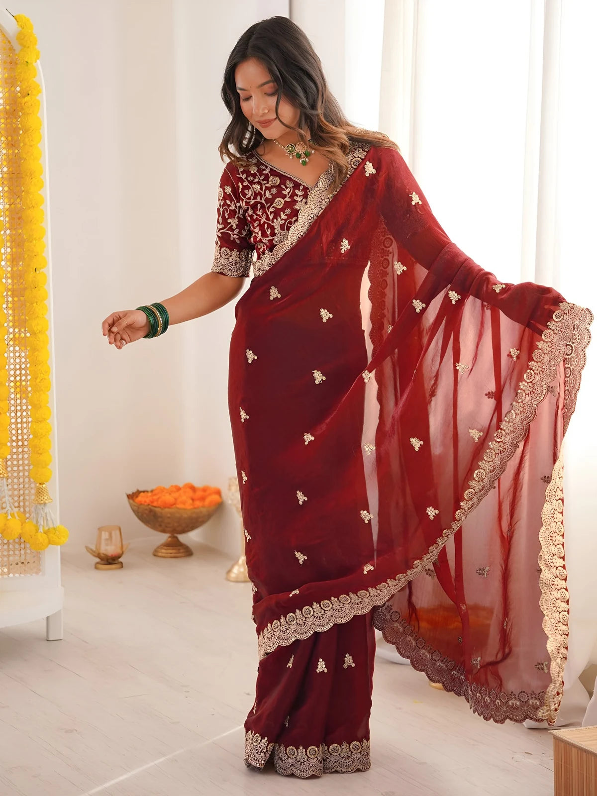 Tarani Mrunmayi maroon saree pallu view with sequin thread embroidery border