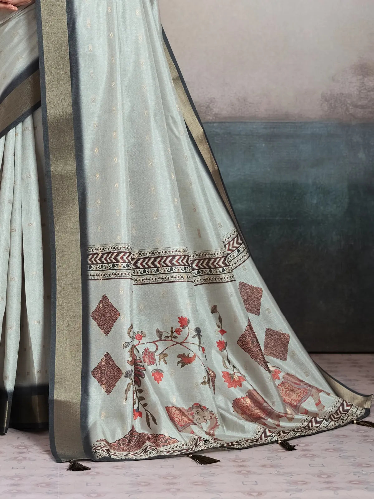 Tarani mint green saree pallu view showing floral and elephant motifs