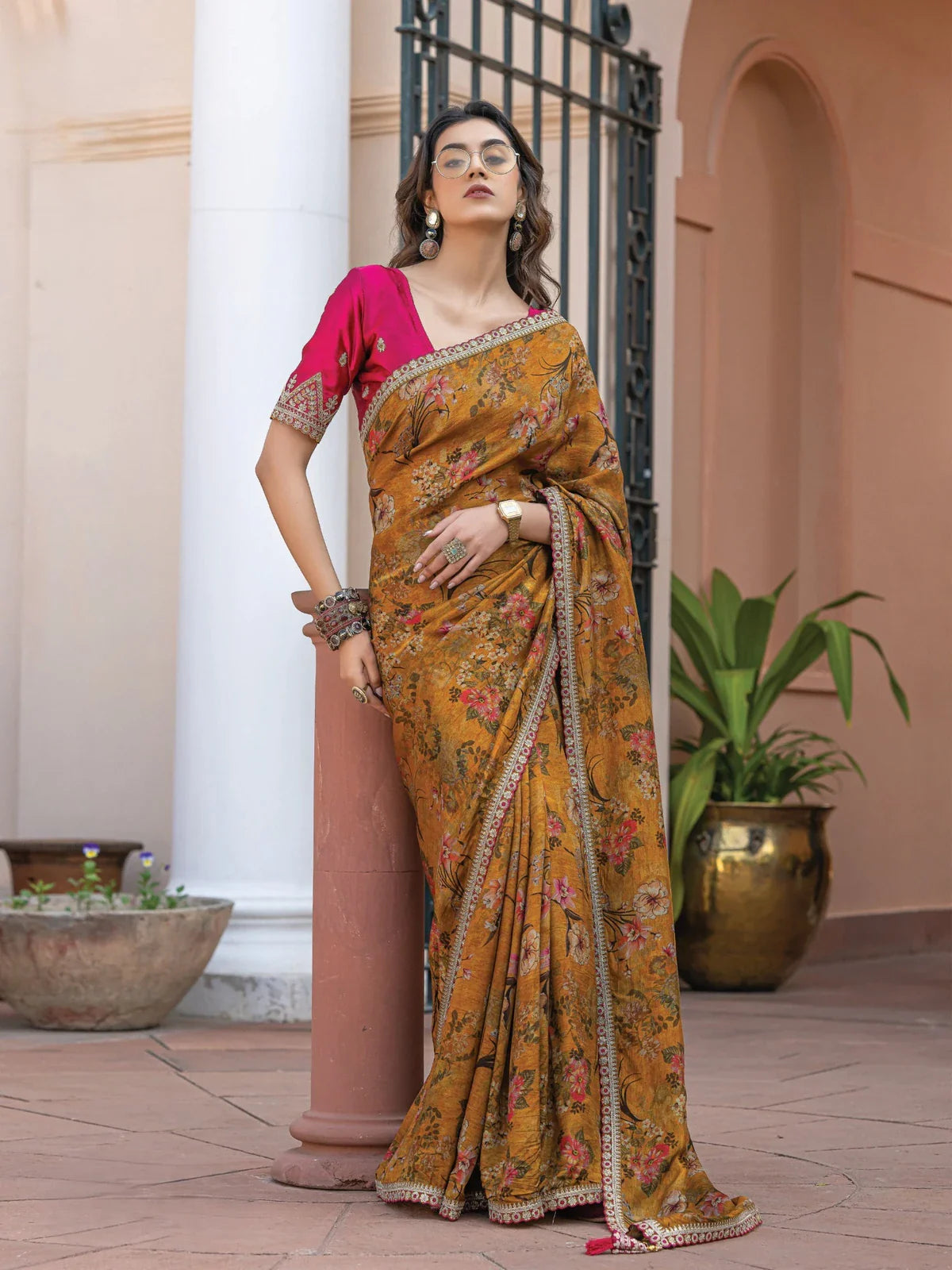 Tarani Ankura mustard viscose dola silk floral saree full view with embellished border and contrast pink blouse