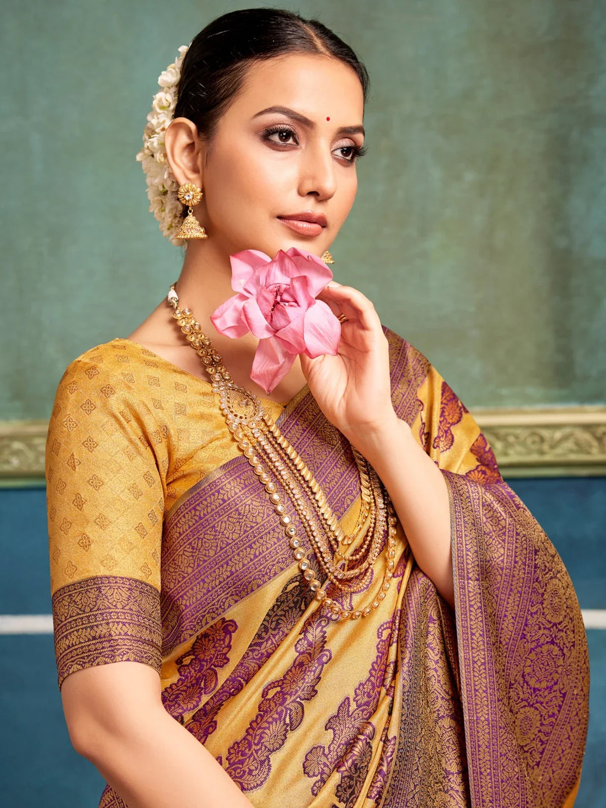 Tarani festive mustard silk saree upper body look with elegant violet motifs and styled jewellery