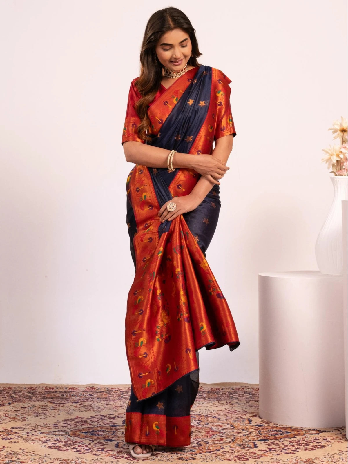 Tarani navy blue Paithani saree front drape view with floral woven butties