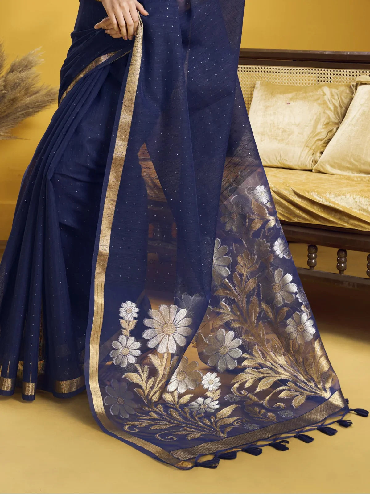 Tarani navy blue silk saree pallu view showing golden floral detailing and zari border