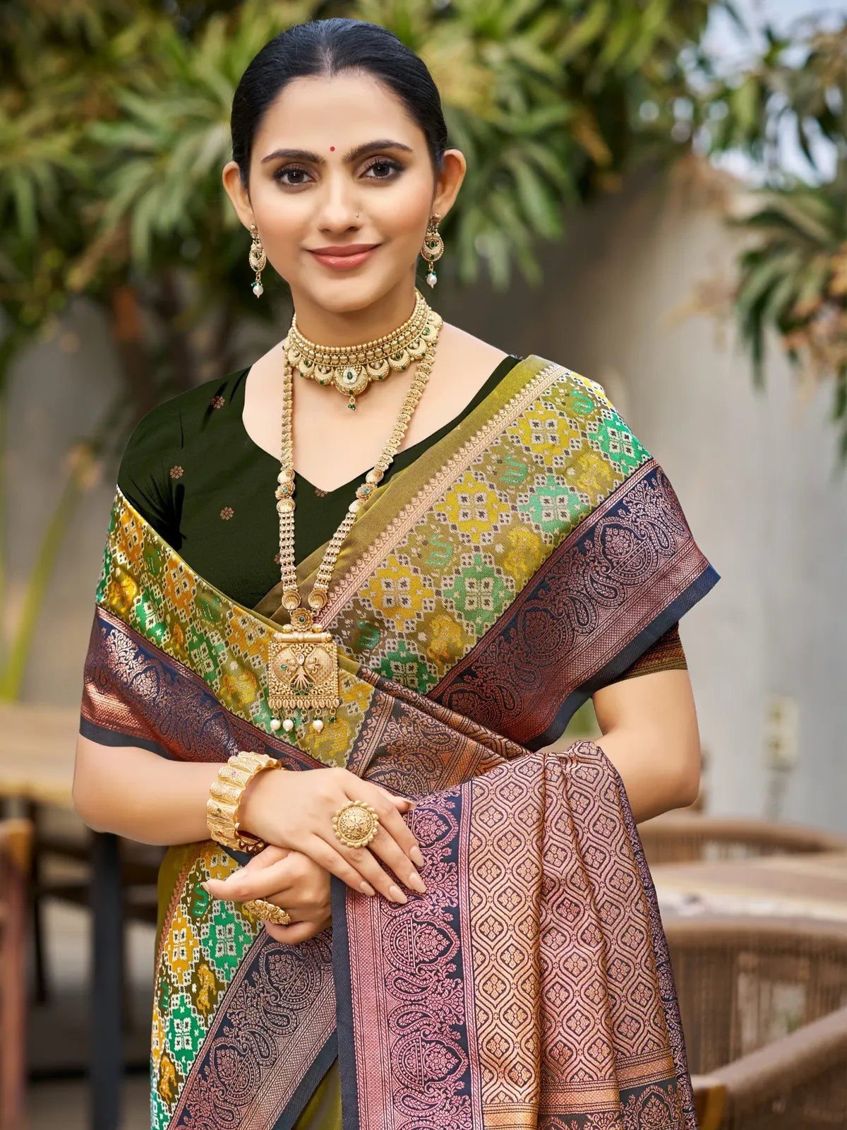 Tarani olive green woven soft silk saree upper body view with contrast border and designer blouse