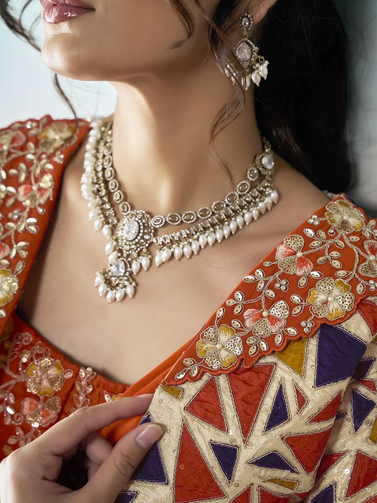 Tarani Kanta orange satin silk saree closeup with multi thread sequin stone pearl applique work