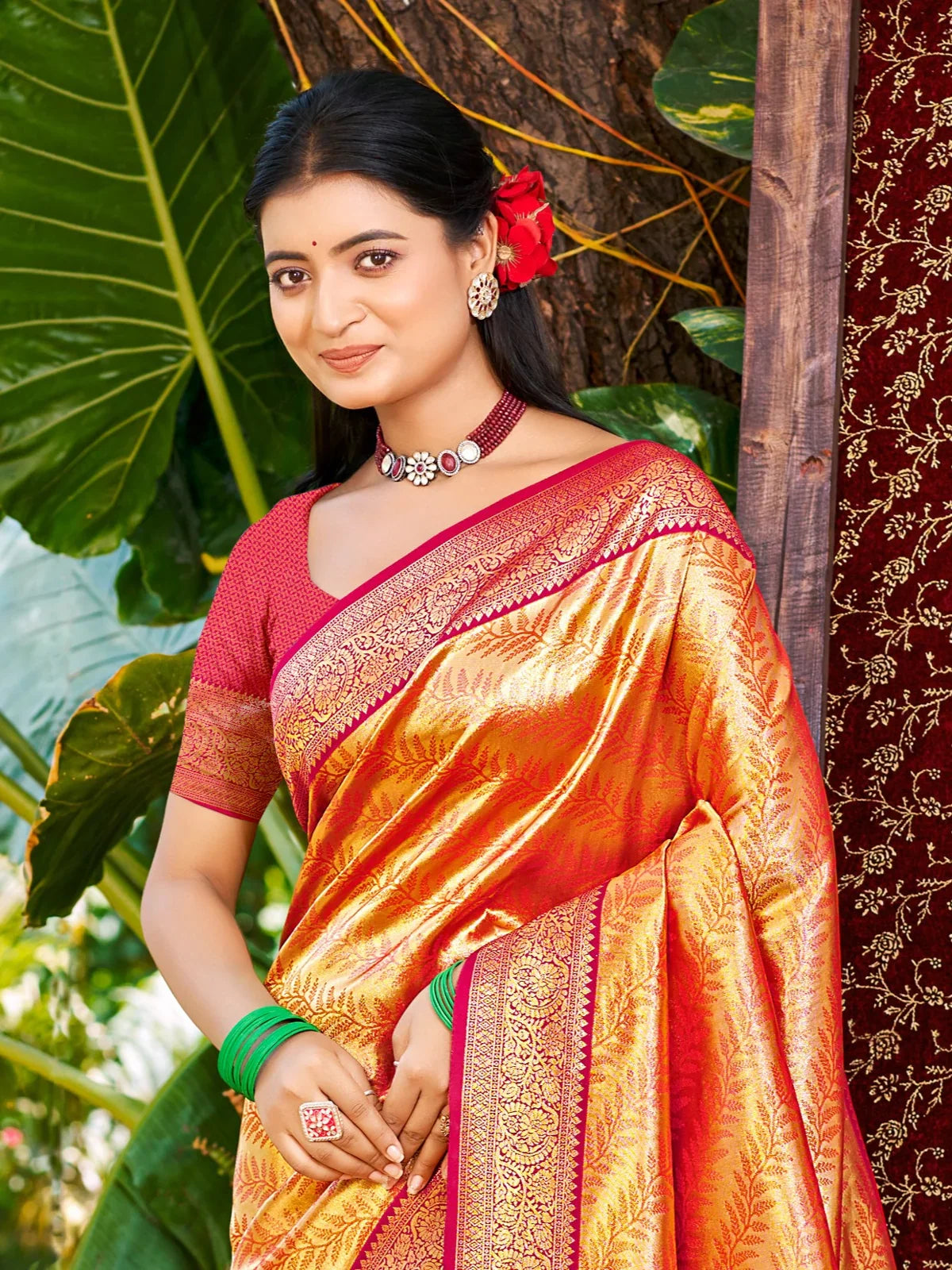Tarani elegant orange Kanjivaram silk saree front view with zari woven pattern