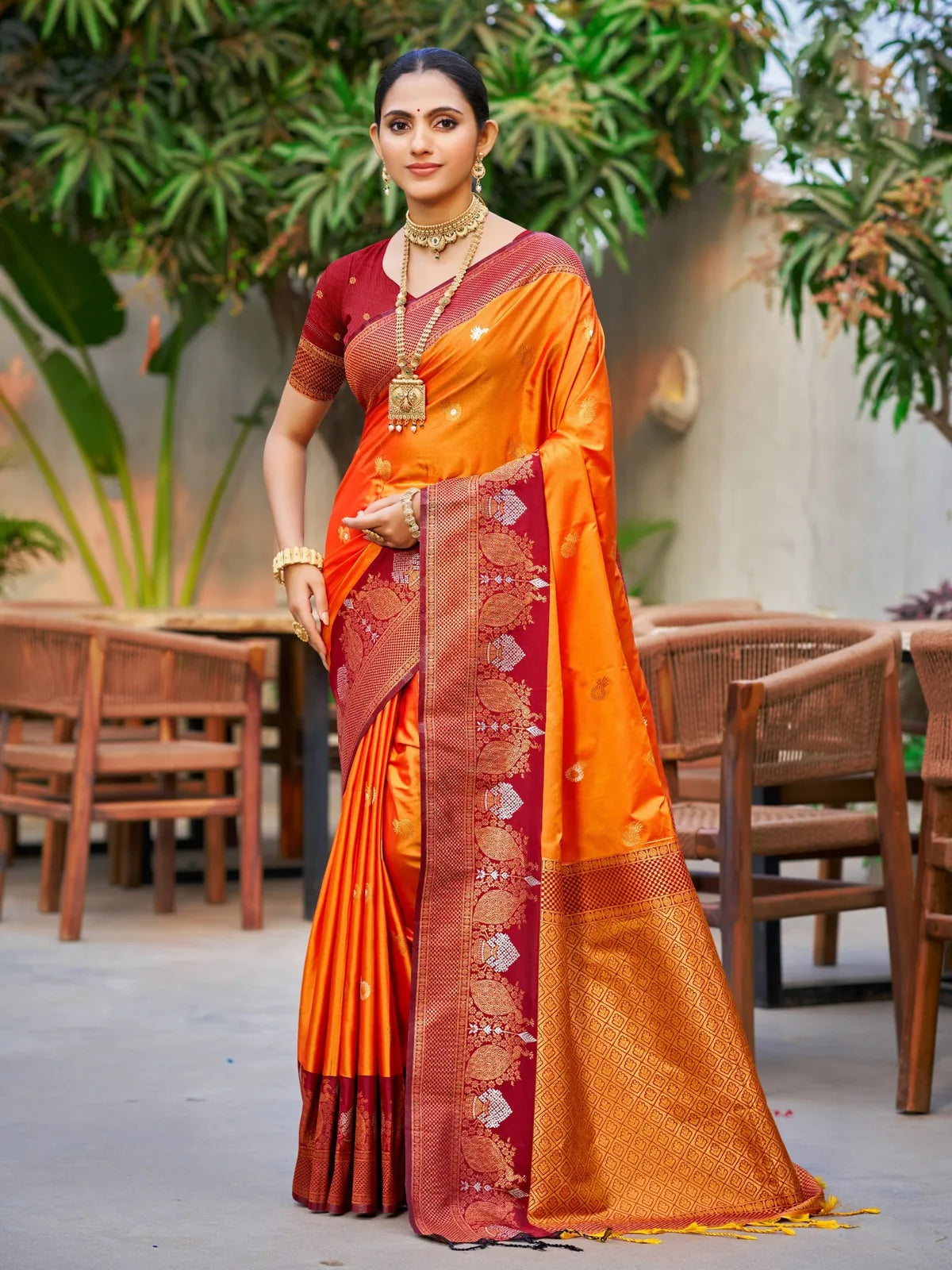 Tarani orange soft silk saree with zari weaving and contrast border full view for festive wear