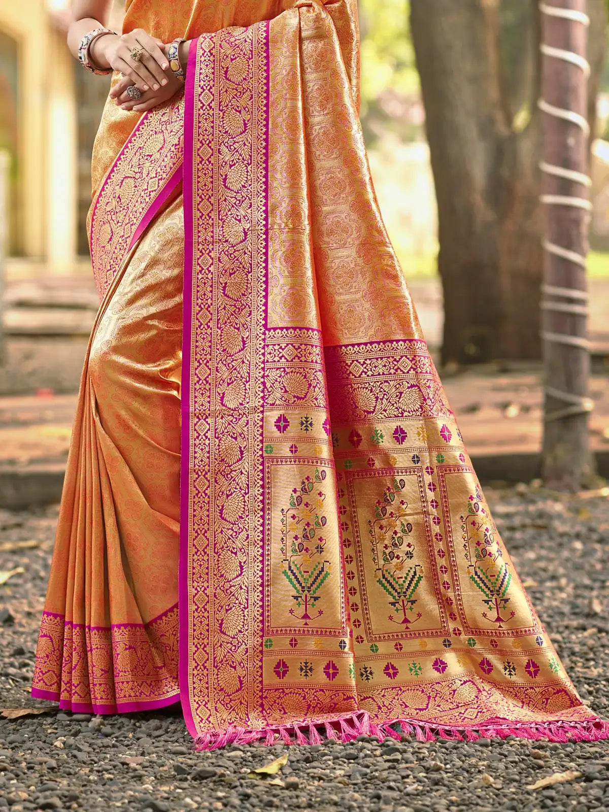 Tarani orange Kanjivaram silk saree close view of pallu and border