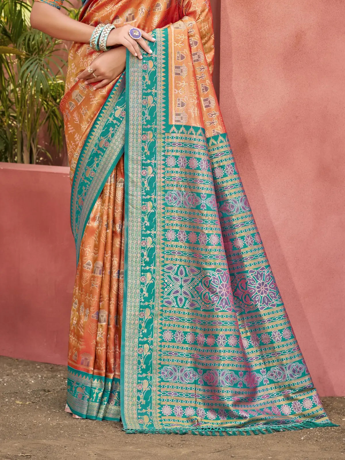 Tarani orange kanjivaram silk saree with detailed woven teal pallu view