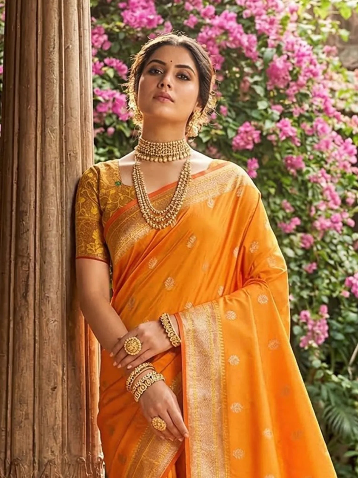 Tarani Minal orange soft silk saree upper body view with zari blouse and jewelry