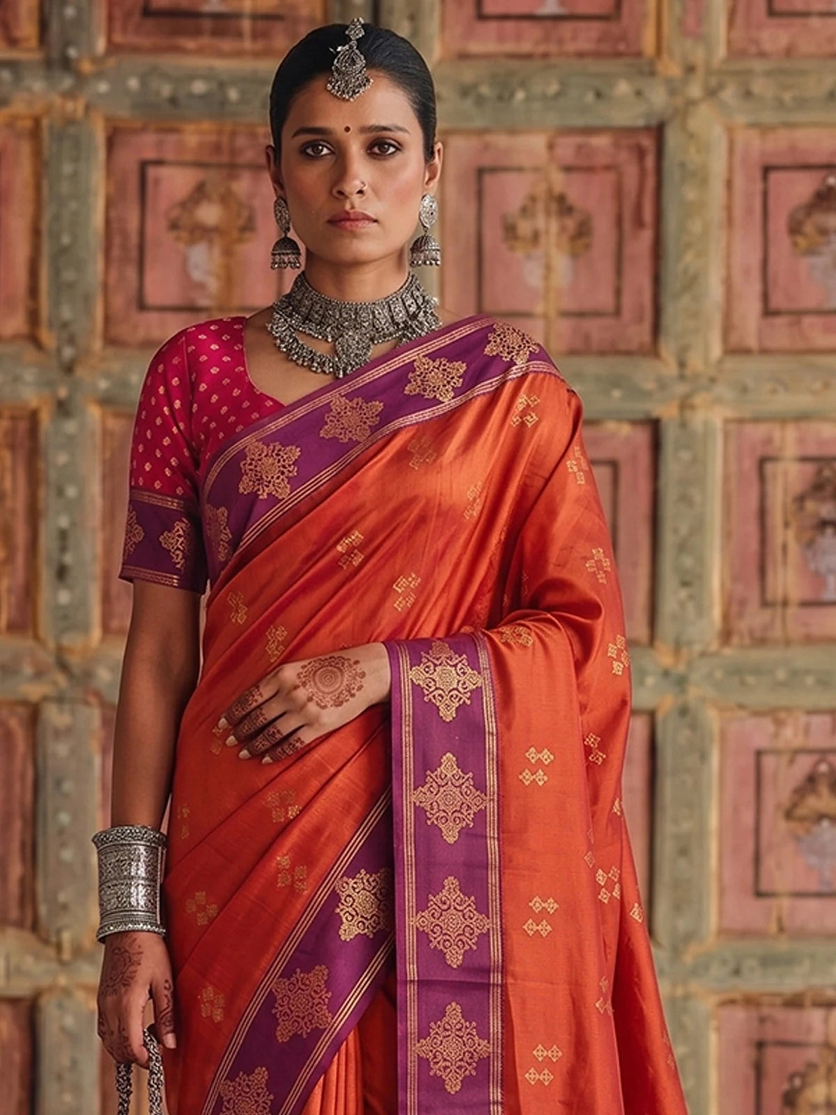 Tarani premium soft silk orange saree with purple woven border upper body view