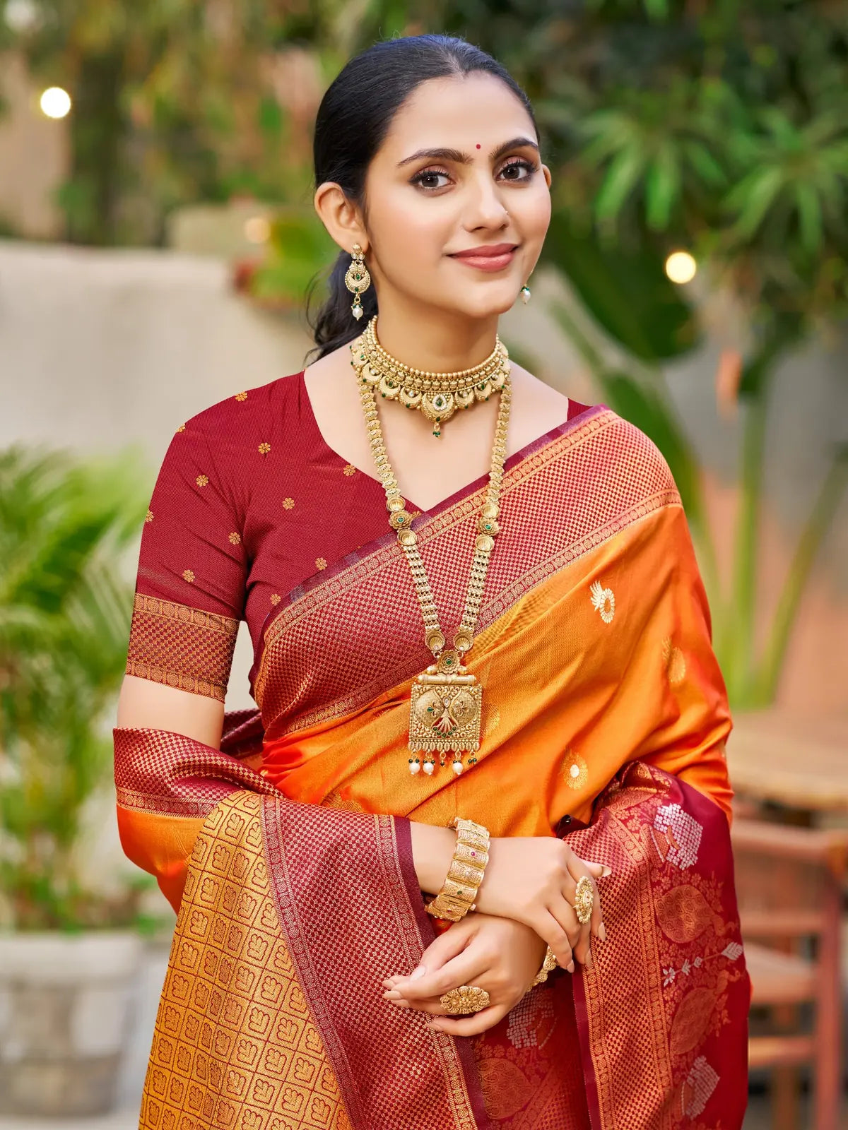 Tarani orange soft silk saree upper body view with woven blouse and zari detailing