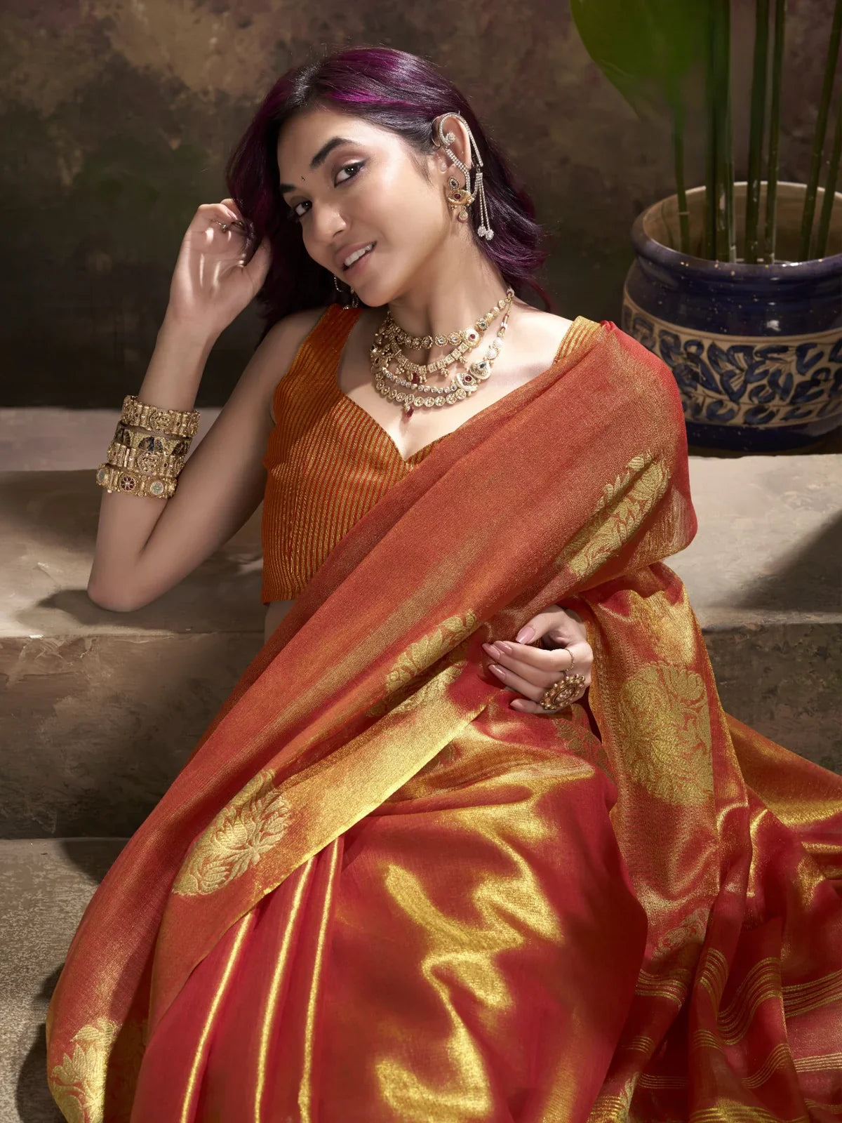 Tarani festive orange tissue silk saree with blouse upper body pose