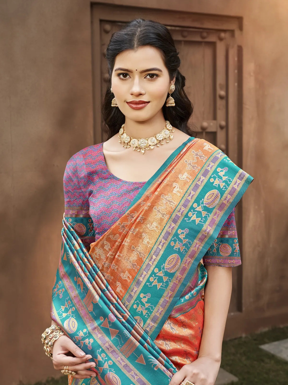 Tarani orange kanjivaram silk saree upper body closeup highlighting blouse and jewellery