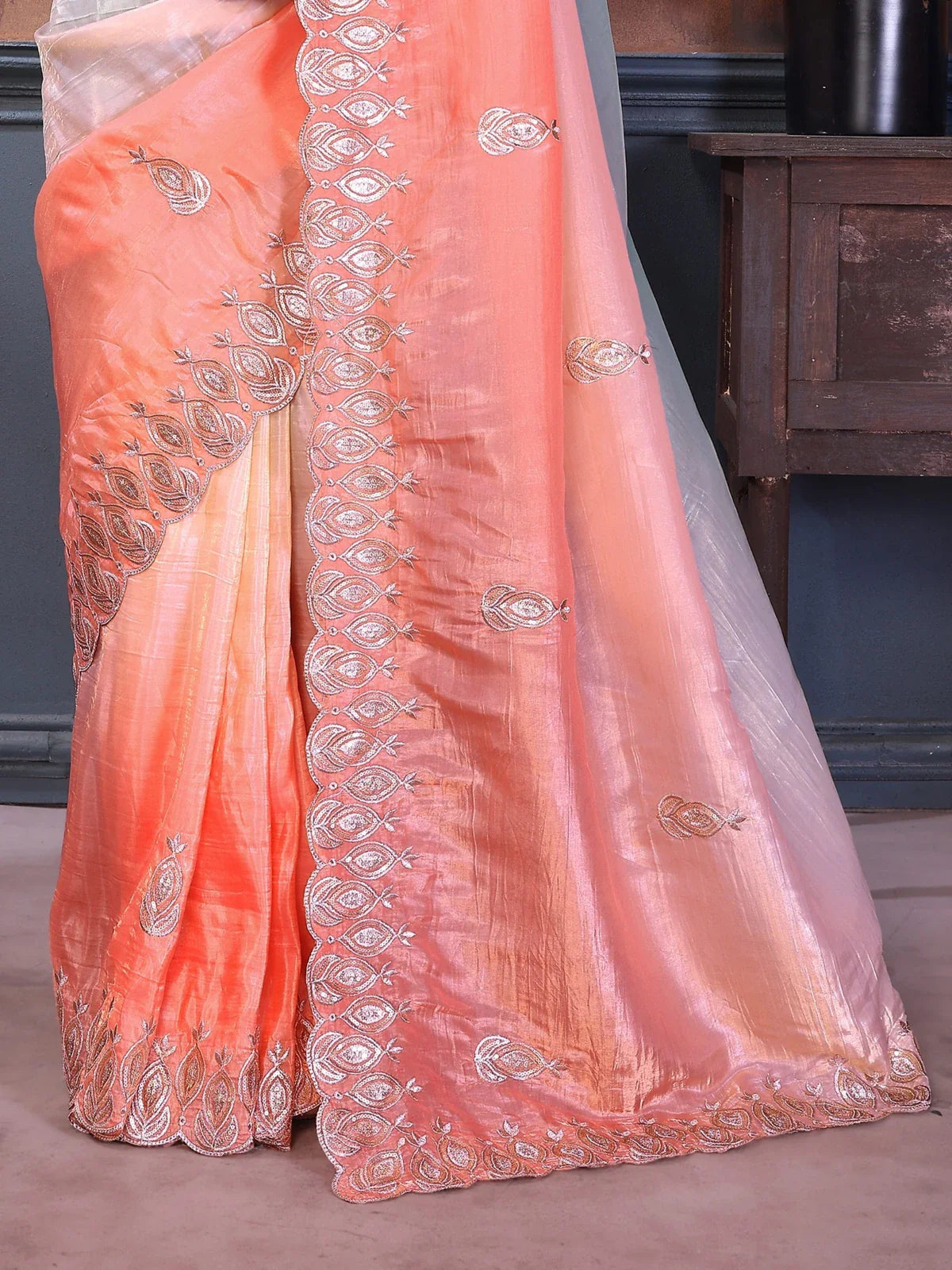 Tarani peach pallu closeup with silver thread embroidery and soft shimmer fabric