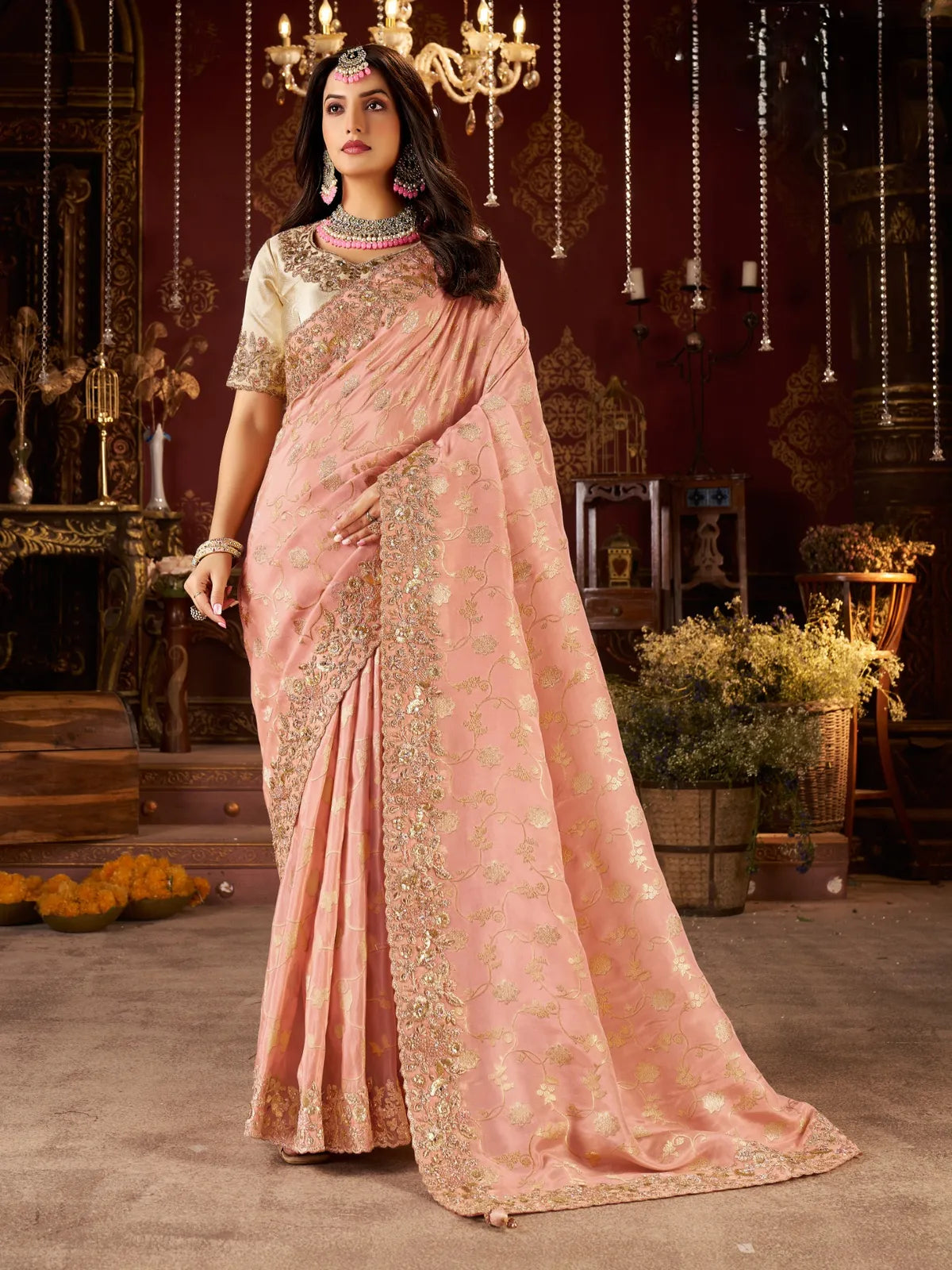 Tarani peach silk saree with golden zari embroidery and heavy latkan pallu for wedding occasions