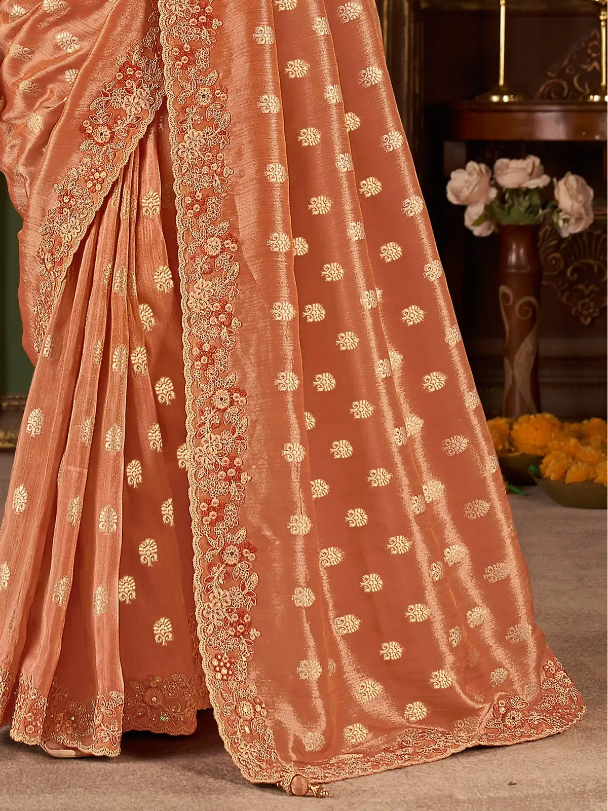 Tarani peach silk saree, pallu view with intricate border embroidery and heavy latkan highlights
