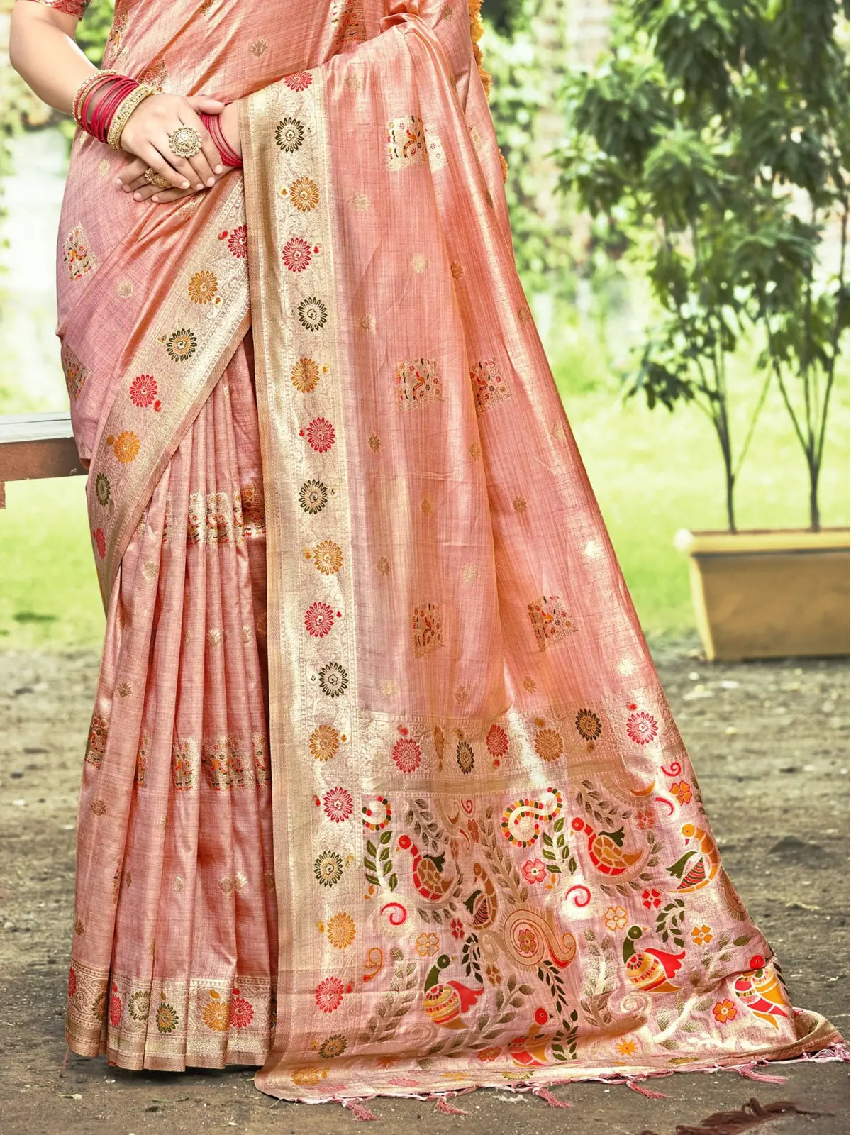 Tarani peach silk saree pallu detail with multicolor thread motifs and golden border