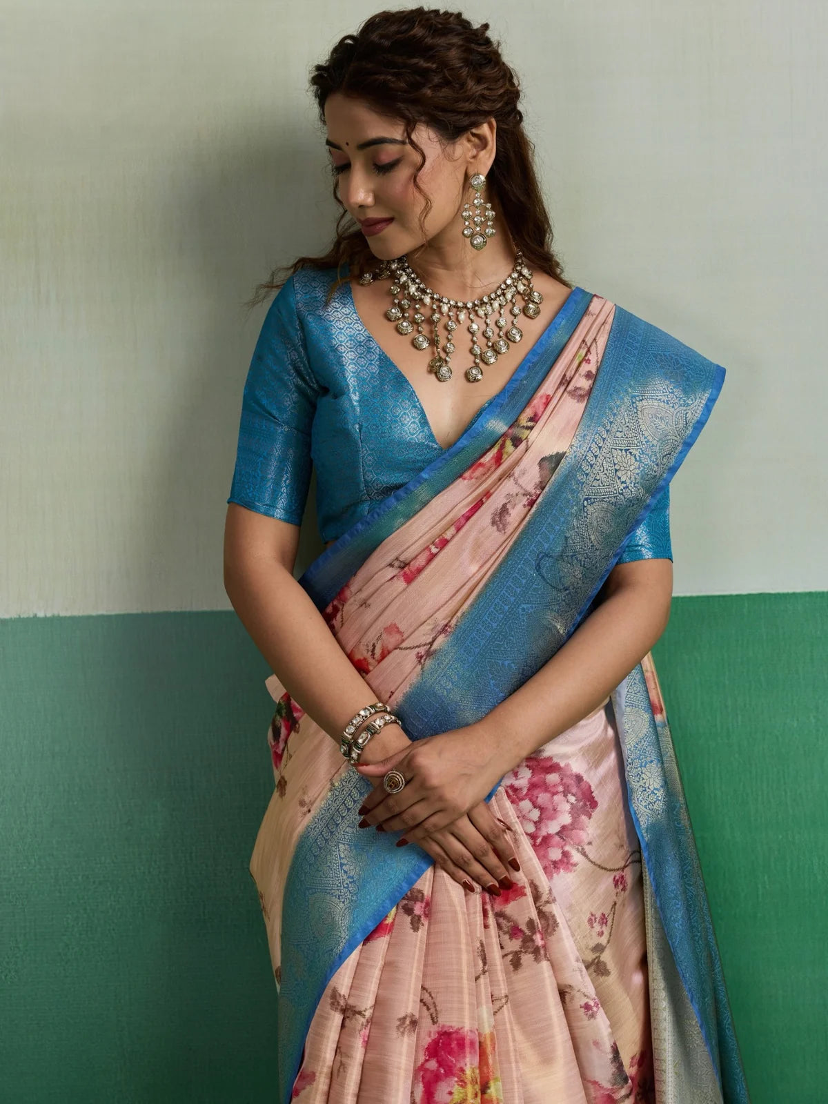 Tarani Pure Kanjivaram Tissue Silk peach floral saree upper body view with rich woven border