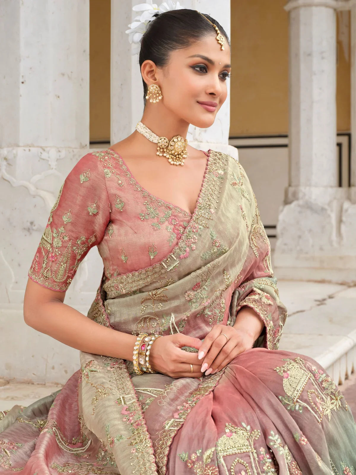 Tarani peach silk saree blouse close-up with embroidery and model jewellery styling