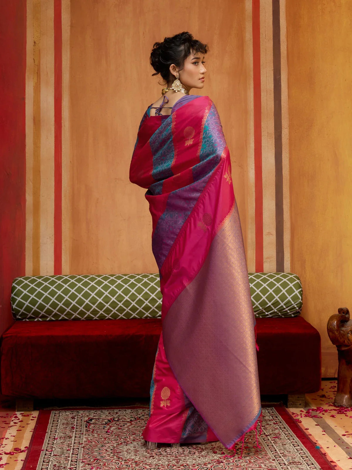 Tarani back pose showcasing full pink silk saree with golden designs