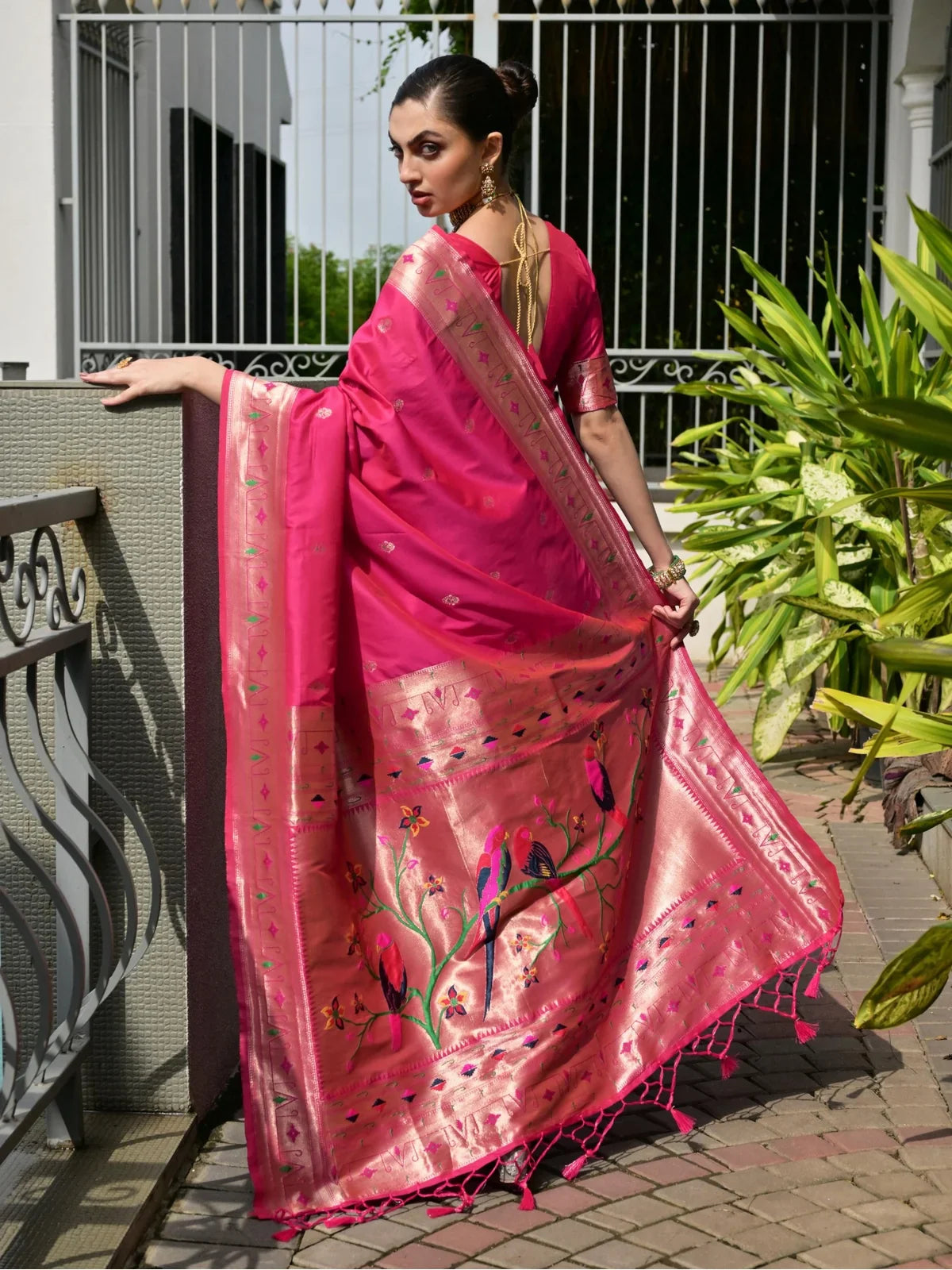 Tarani premium silk saree in pink back view showing full pallu drape with rich detailing