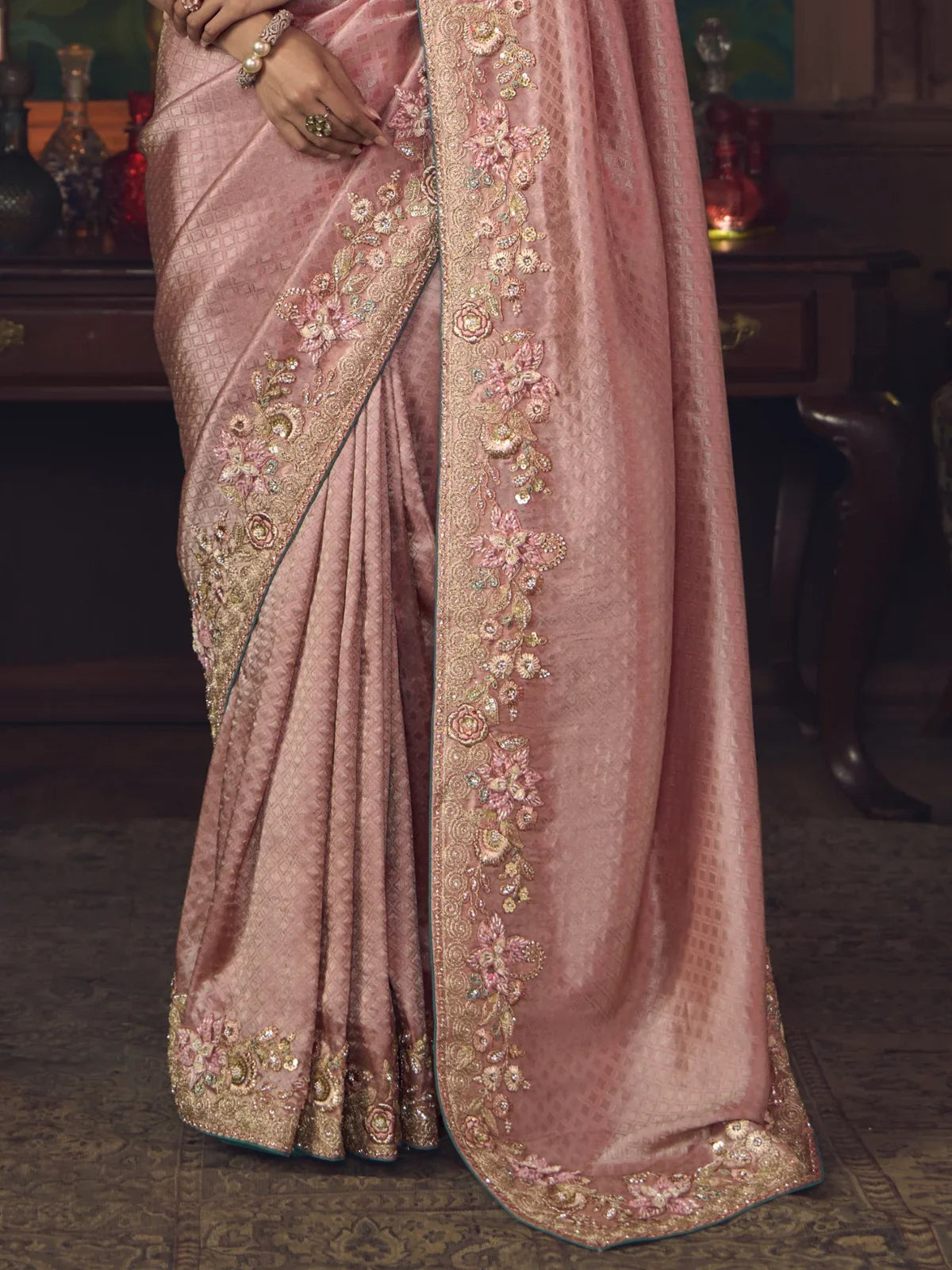 Tarani soft pink saree with floral embroidery detailing on border and pallu closeup view