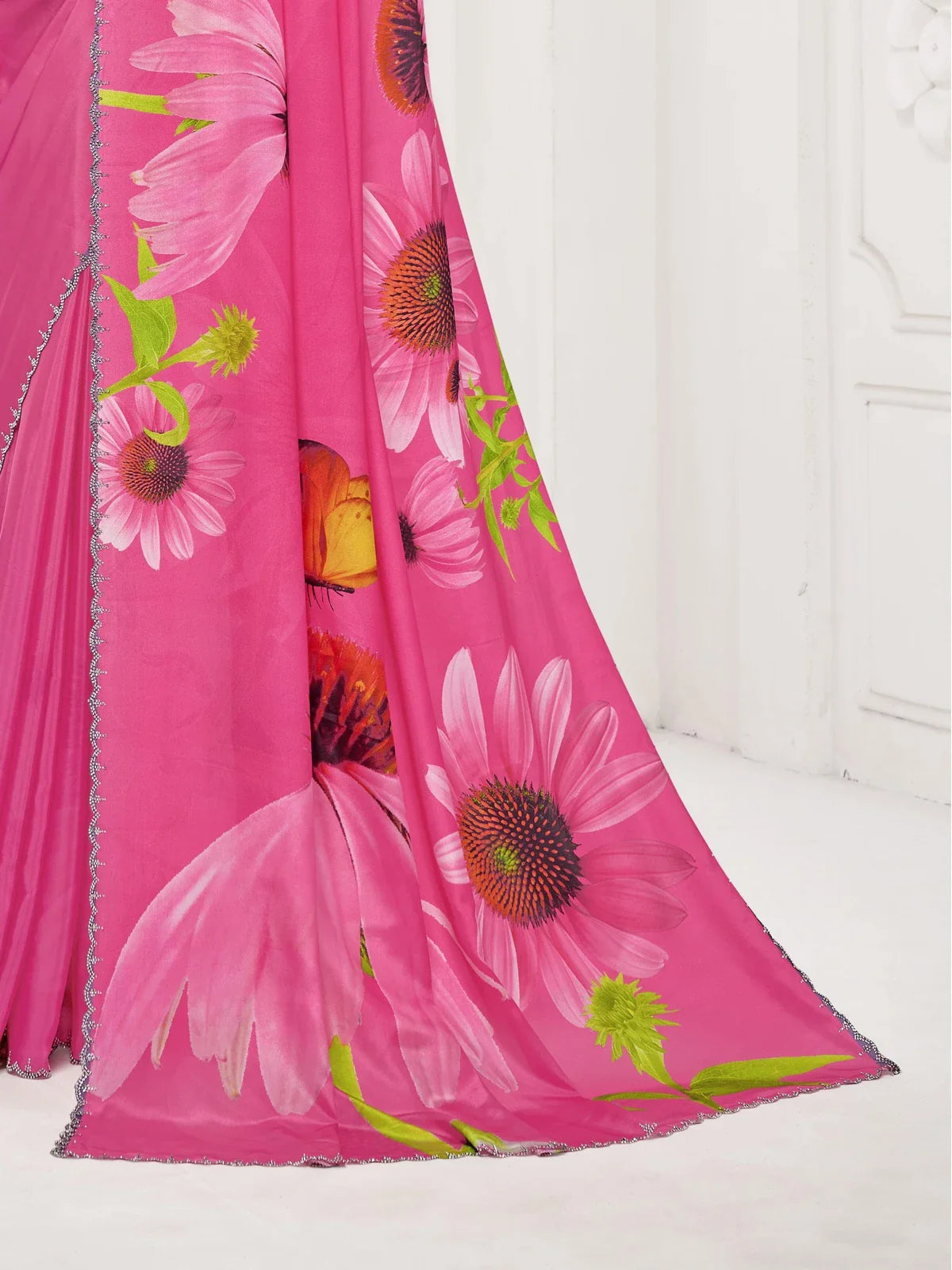 Closeup of Tarani pink floral saree with digital print and Swarovski work border