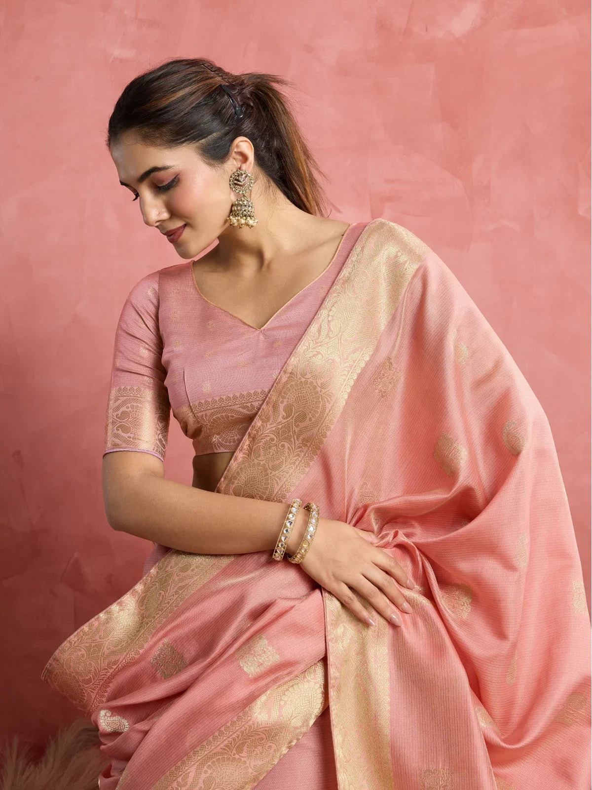 Tarani pink silk saree front pose highlighting rich woven pallu