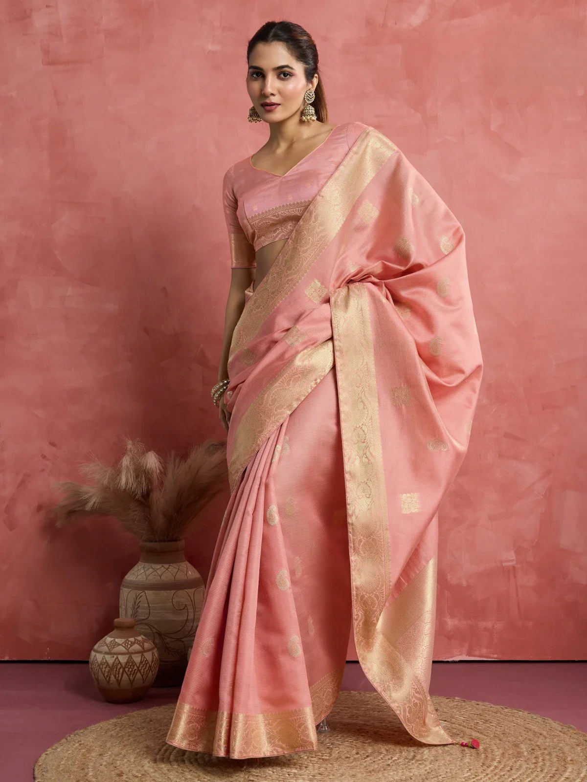 Tarani pink silk saree full view showing graceful drape and golden patta