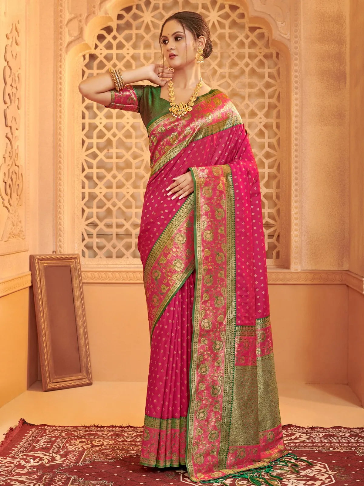 Tarani pink silk saree full view with green border and contrast blouse for party and festive wear
