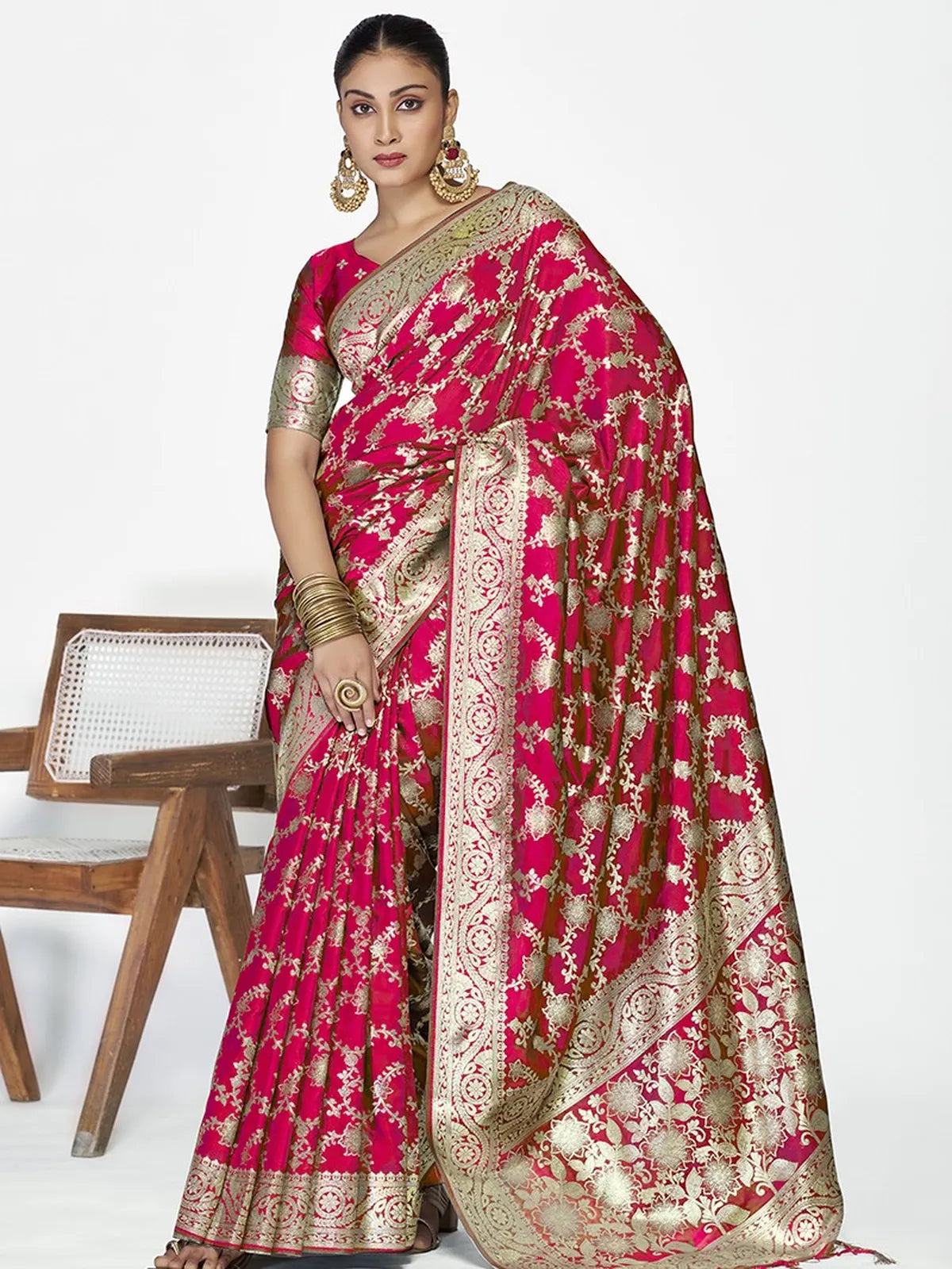 Tarani pink silk saree with golden zari weaving and matching blouse, perfect for festive wear