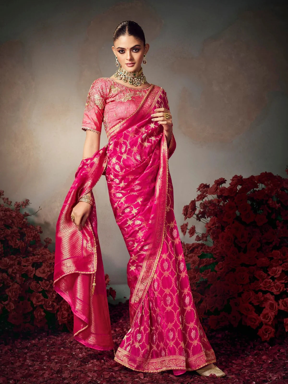 Tarani pink silk saree full view with golden woven motifs and embroidered blouse