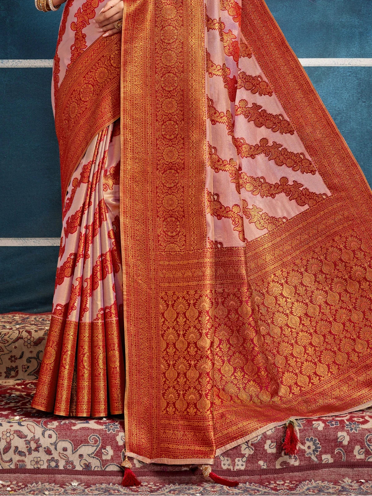 Tarani pink silk saree pallu with golden maroon weaving work in detailed closeup