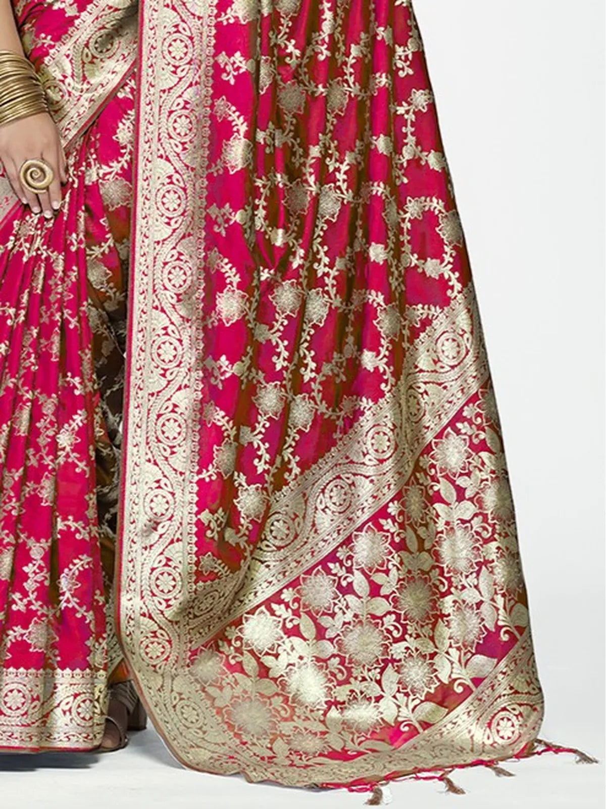 Tarani pink silk saree closeup view showing golden zari detailing and rich weaving texture
