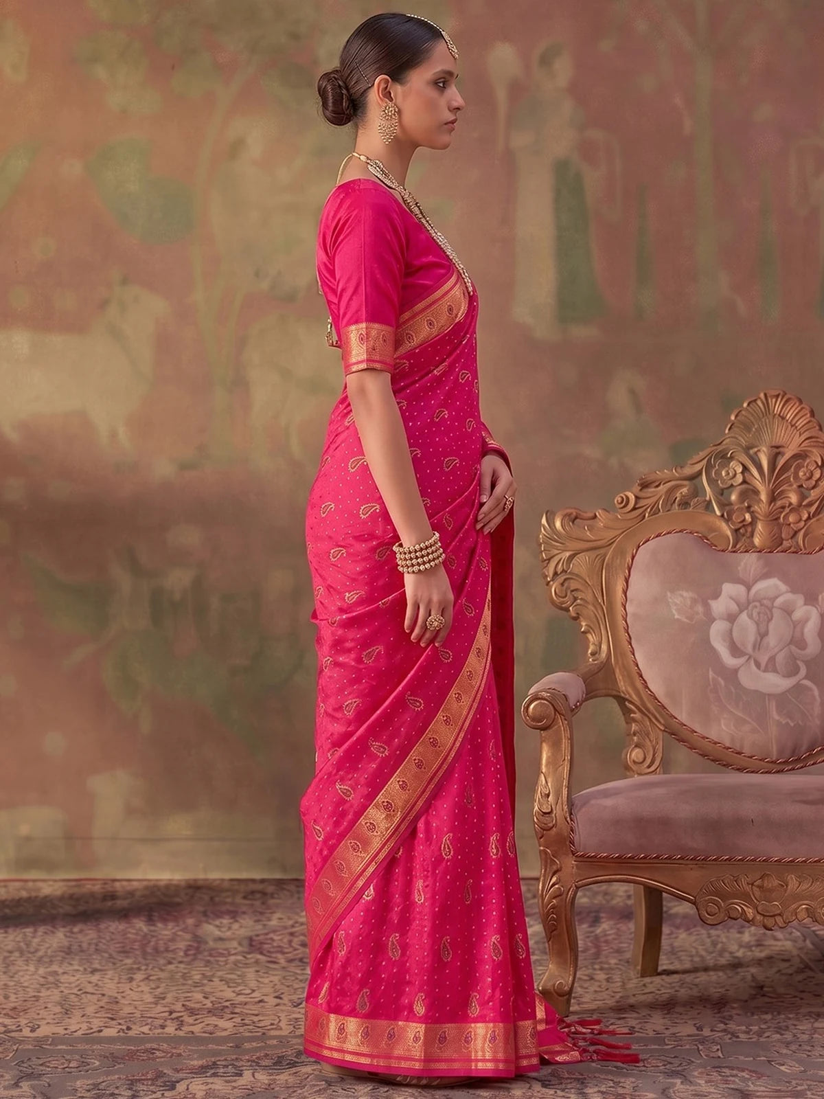 Tarani pink silk zari weaving saree side view showing elegant drape and border