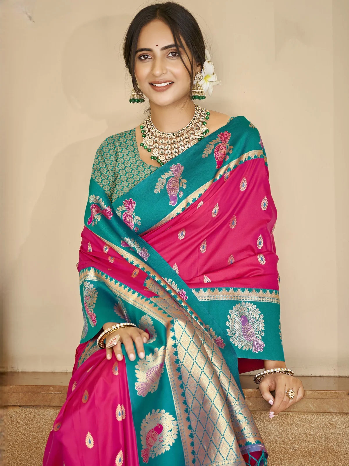 Tarani pink silk saree upper body view with zari weaving and contrast teal pallu