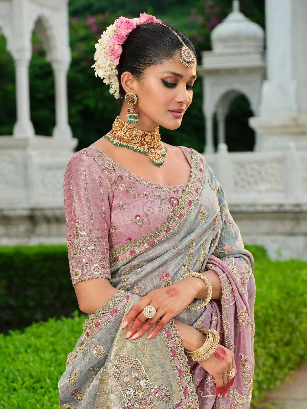 Tarani designer pastel pink saree with intricate embroidery shown in upper body bridal look